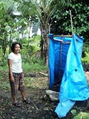 A Lady from Kosai Baru with her new established household toilet